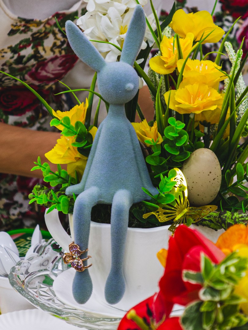 Easter decoration with ceramic bunny and flowers