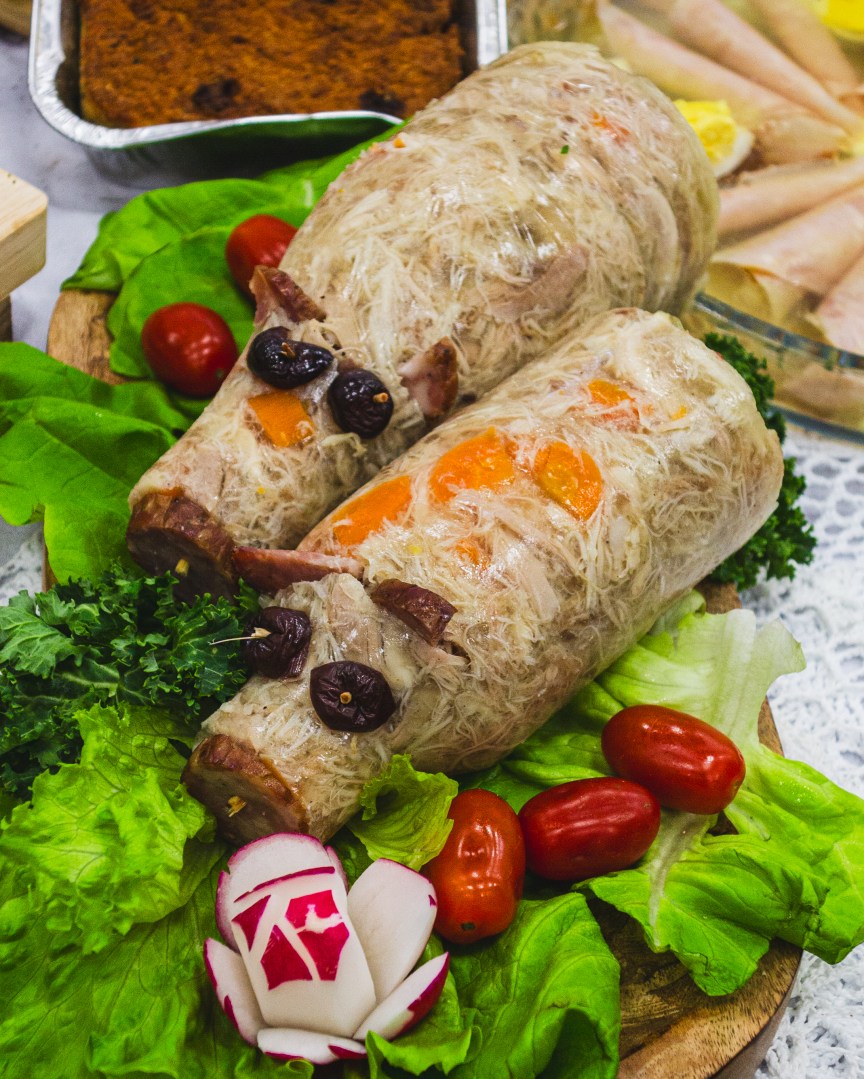 Easter cold cuts dish shaped like logs with veggies