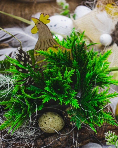 Easter decoration with greenery, eggs and bird motif