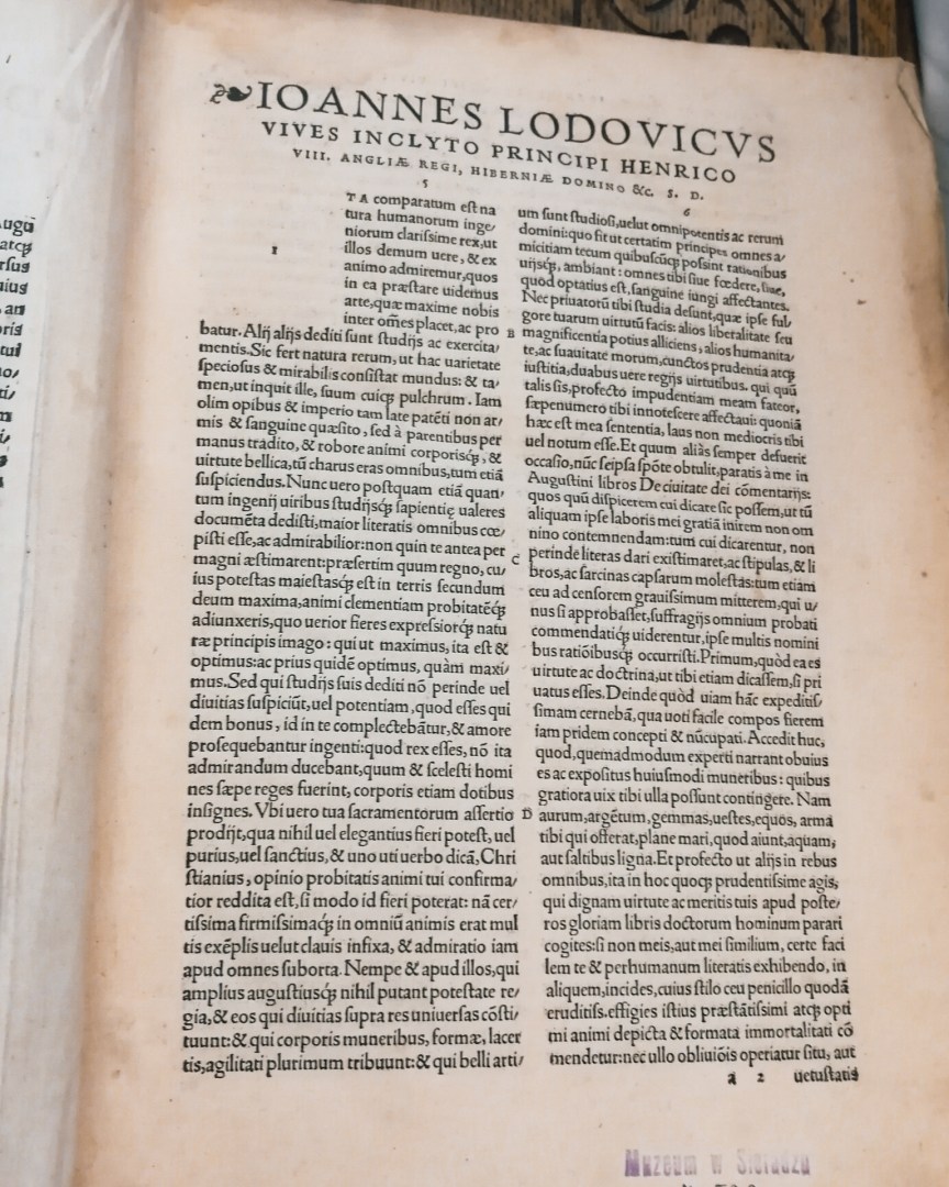 A rare Latin book from the 17th century on display in the library.