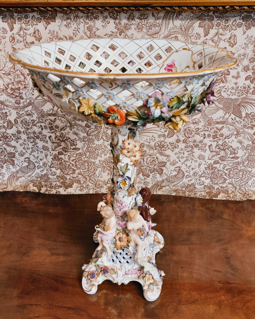 Ornate porcelain fruit bowl on display at the Walewski Museum in Tubądzin.