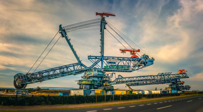 Cyclist's view of the massive K-41 bucket-wheel excavator near Bełchatów, Poland, during a rare maintenance stop
