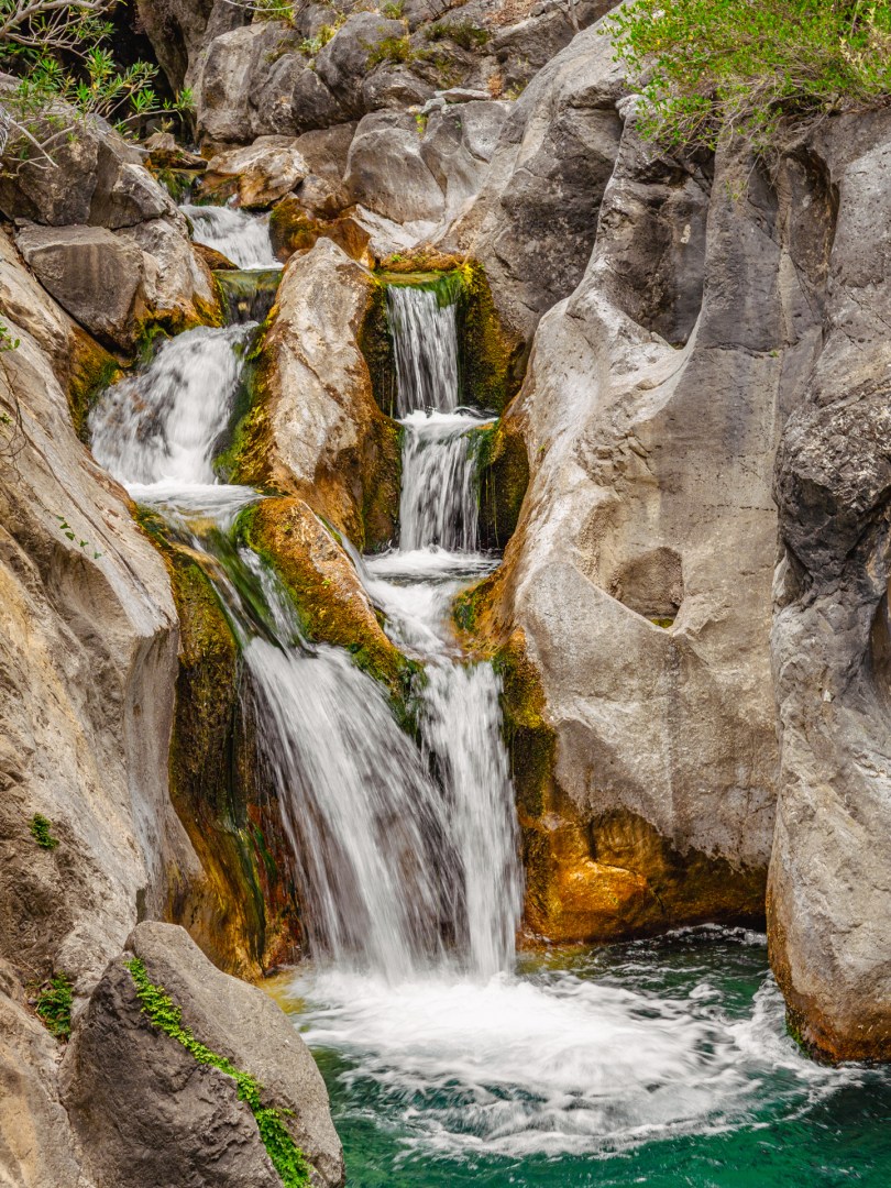 Layered cascade in a narrow rock crevice in Sapadere Canyon