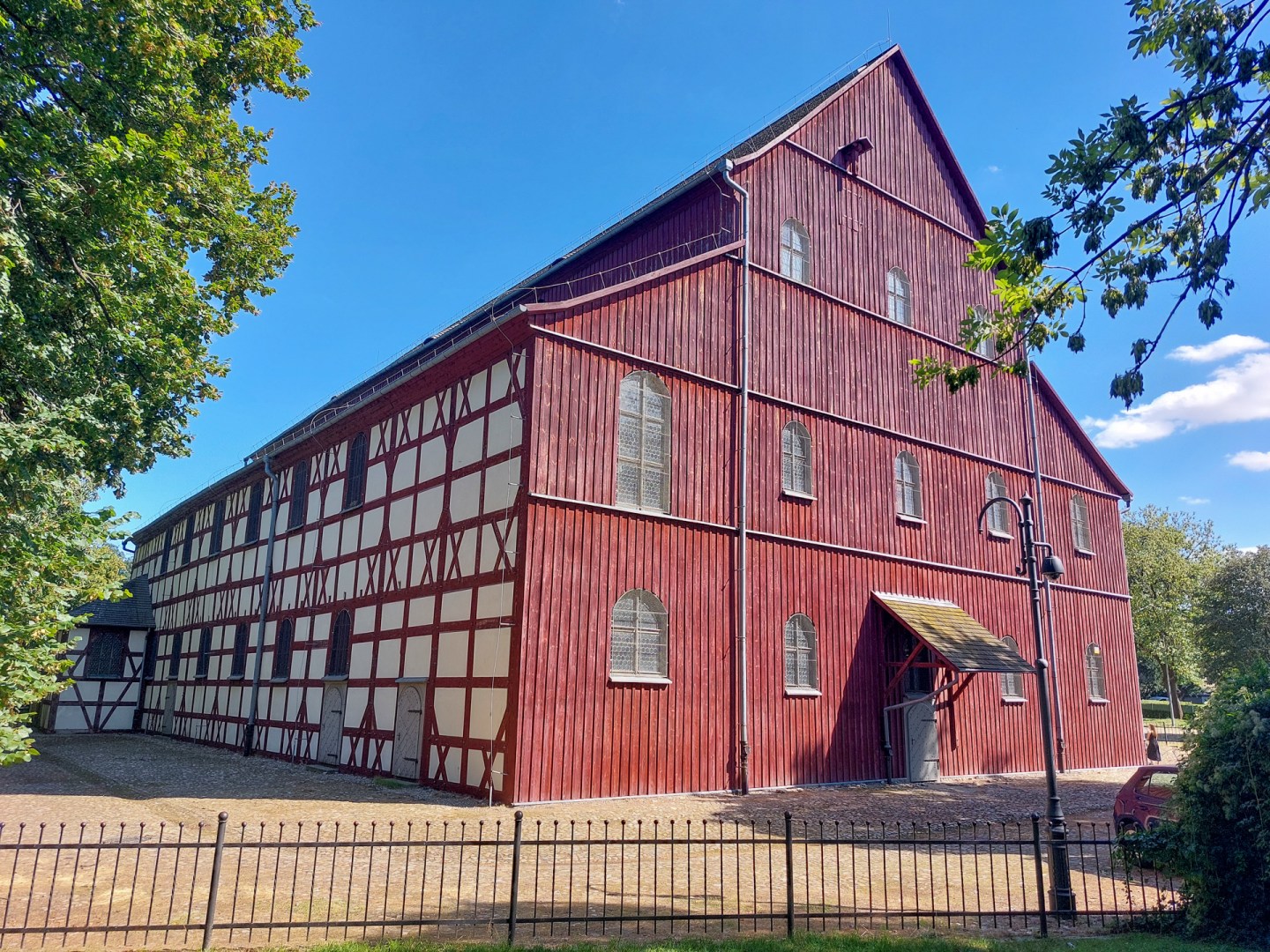 Red timber-framed building near the Church of Peace in Jawor