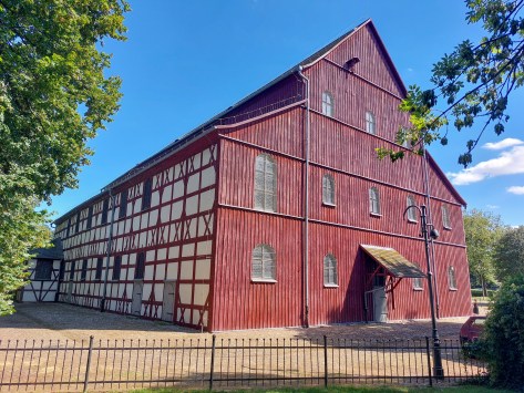 Red timber-framed building near the Church of Peace in Jawor