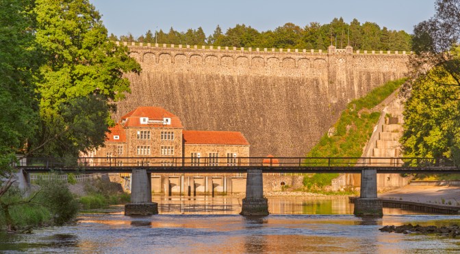 Historic dam on the Bóbr River in the Land of Extinct Volcanoes, Poland, photographed with the bridge in the foreground and edited in Photoshop to enhance light and reflections