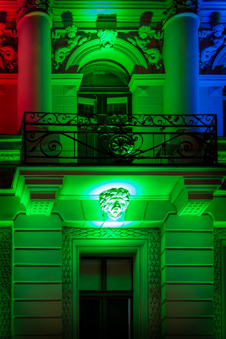 Facade lit in green, red, and blue light during Light Move Festival 2025 in Łódź