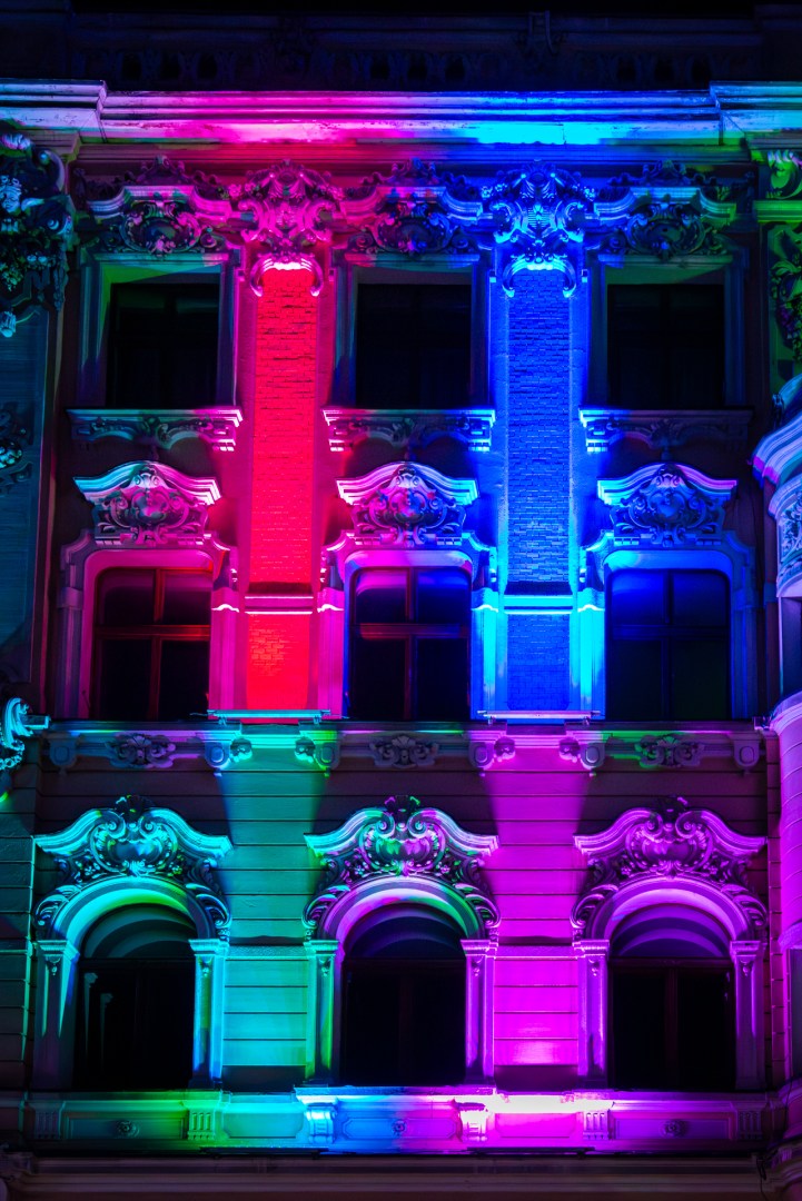 Multicolored building facade projection at the Light Move Festival 2025 in Łódź