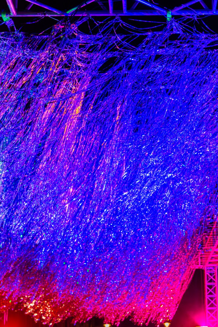 Vivid pink and blue projections over a building facade at Light Move Festival 2025 in Łódź