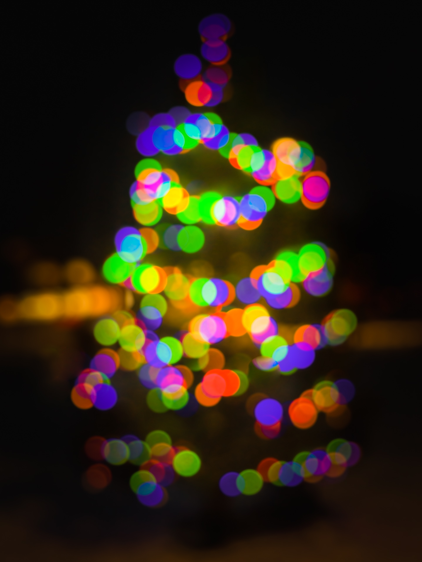 Abstract bokeh lights from a Christmas tree symbolizing the transition into the New Year