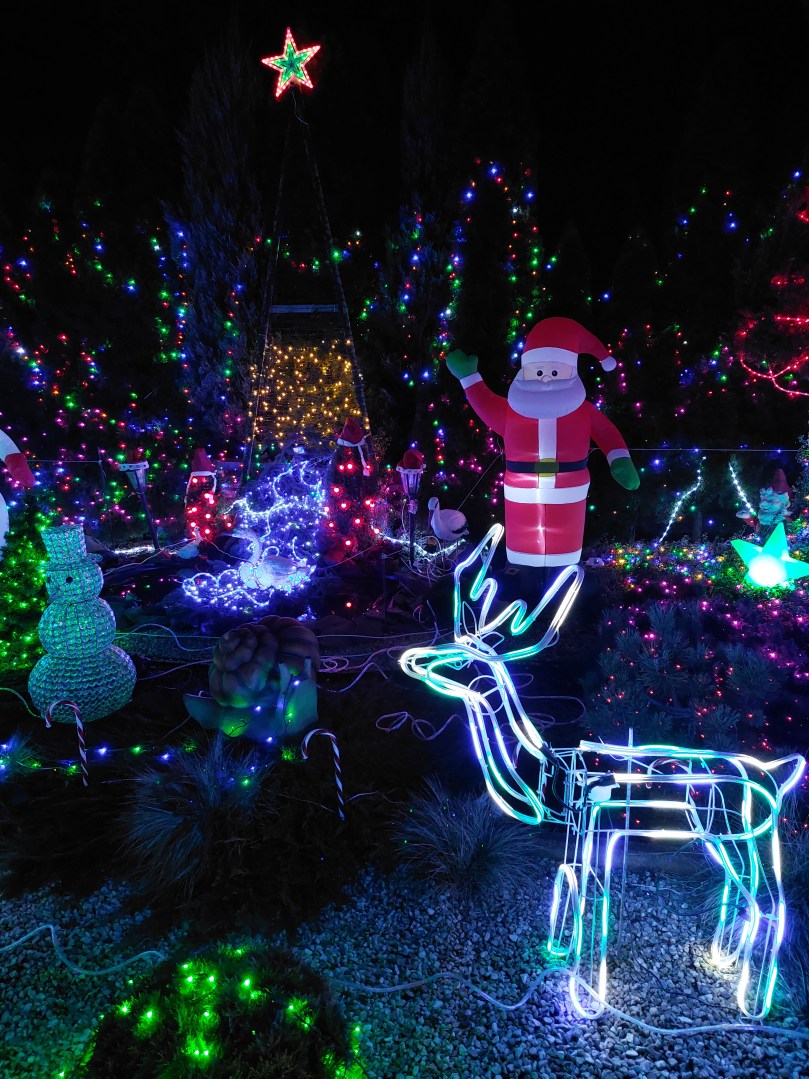 Illuminated fountain with reindeer and snowman figures at Polish Las Vegas
