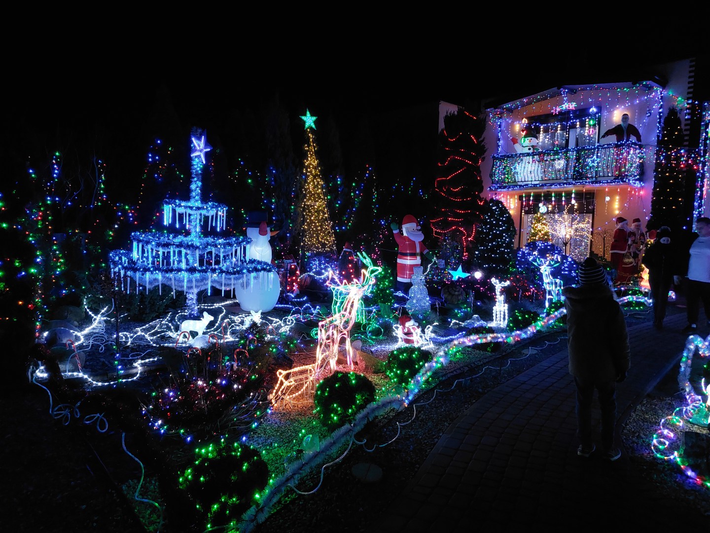 Overall view of Polish Las Vegas in Sieradz with dense Christmas lights and winter decorations after dark